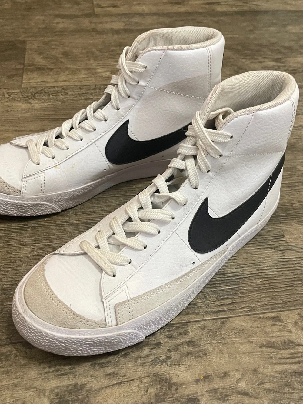 Nike White High-Top Sneakers with Black Swoosh